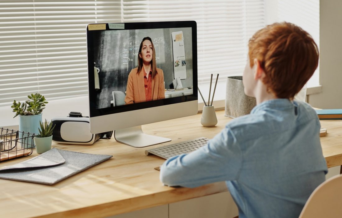 Photo Of Child Sitting By The Table While Looking At The 4145153